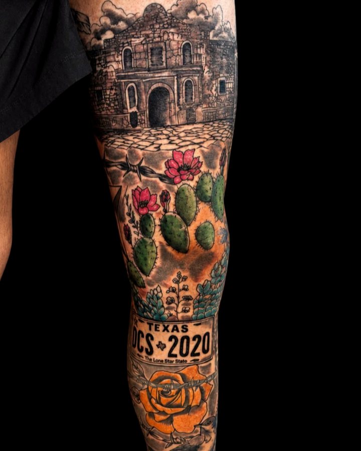 Full-color Texas leg sleeve - the Alamo above prickly pear in bloom and a Lone Star plate, running the length of the shin.