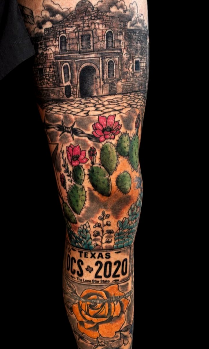 Full-color Texas leg sleeve - the Alamo above prickly pear in bloom and a Lone Star plate, running the length of the shin.